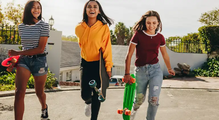 beautiful girls enjoying skateboarding
